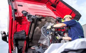 Mechanic repairing a UK HGV during road side assistance call-out
